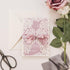 Dreamy Mauve Ivory laser cut lace invitation with background in mauve colors